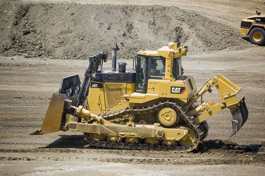 Crawler bulldozer working a stockpile