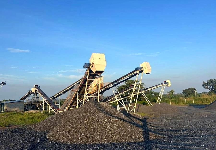 Crushing and screening plant with an aggregate stockpile.