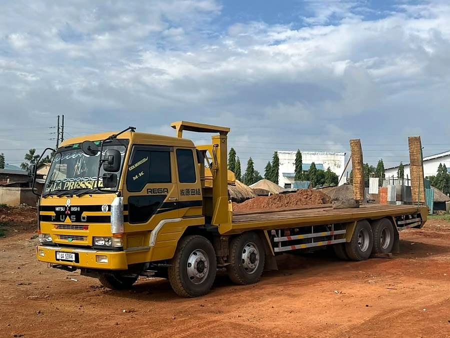 Flatbed equipment-carrier truck.