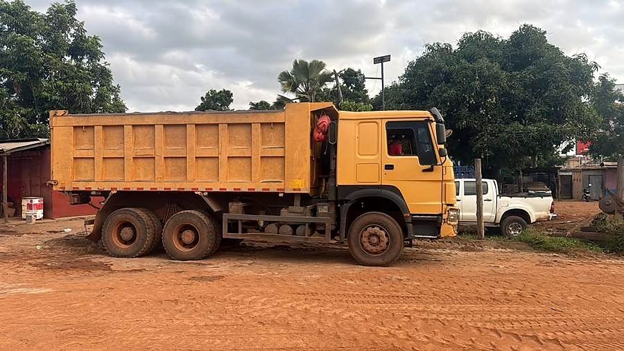 Tipper truck on a red-earth site.